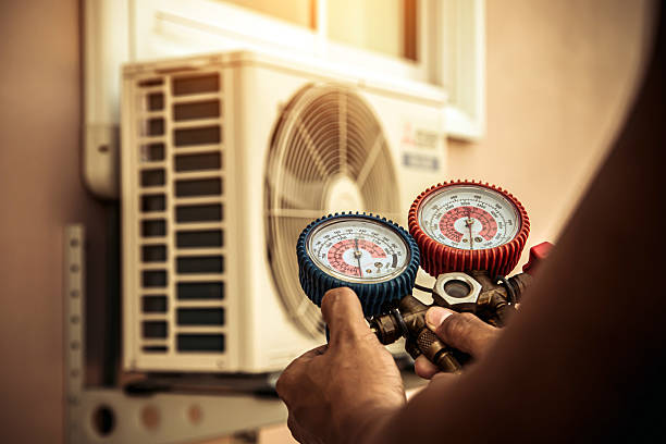 Professional Air Conditioning Service technician working in Rudy, AR